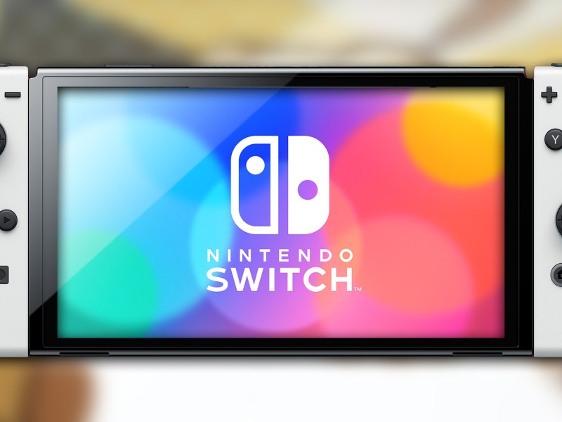 Eine Nintendo Switch OLED mit verschwommenem Hintergrund.