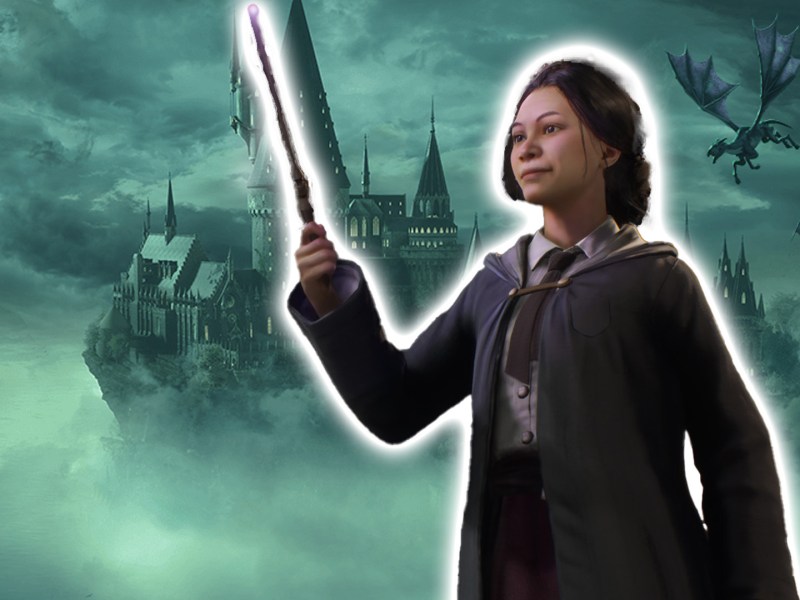 Screenshot aus Hogwarts Legacy. Im Hintergrund ist das Schloss zu sehen. Im Vordergrund eine Hexe mit einem Zauberstab.