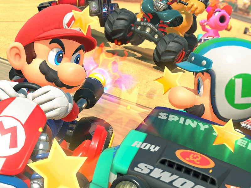 Screenshot aus Mario Kart World. Zu sehen sind Mario und sein Bruider Luigi im Kampf um Platz 1.