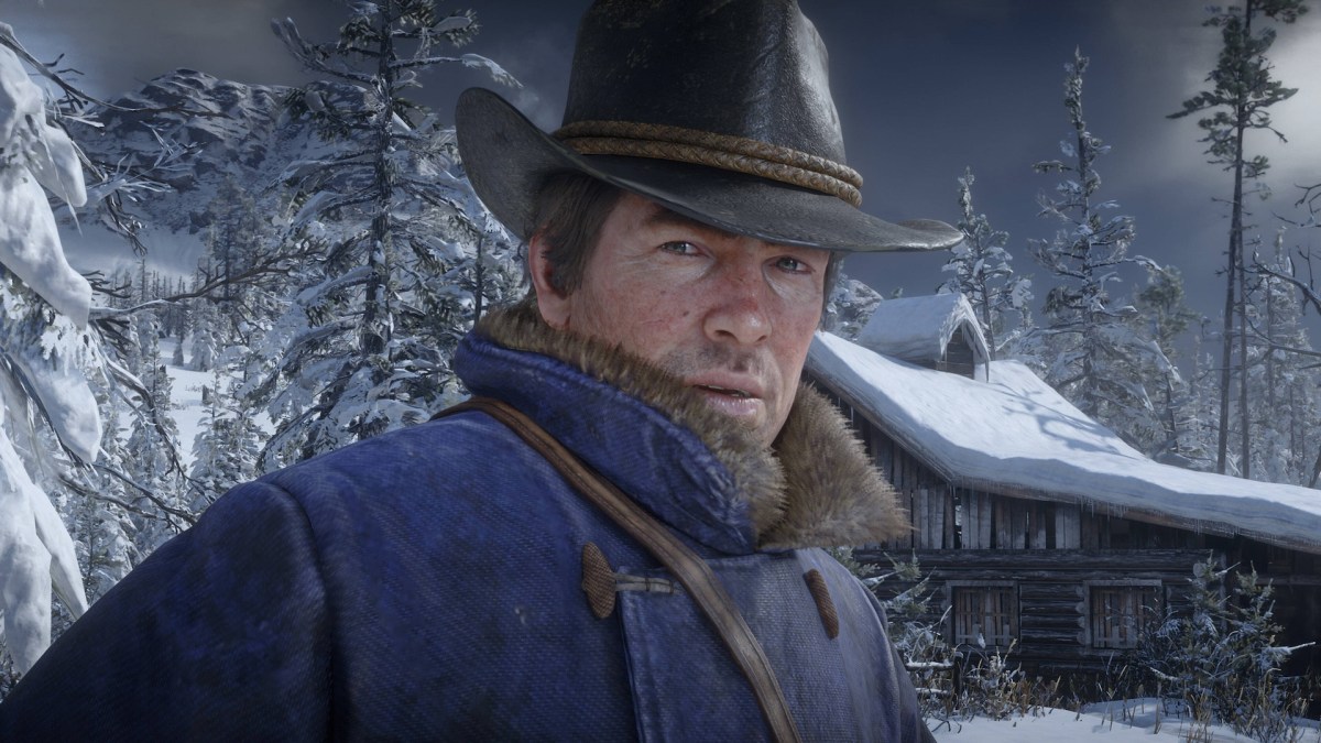 Screenshot aus Red Dead Redemption 2. Zu sehen ist Protagonist Arthur Morgan in Winterkleidung.